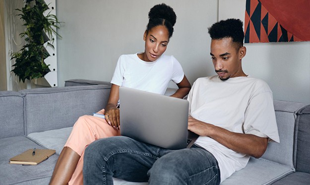 couple looking at laptop