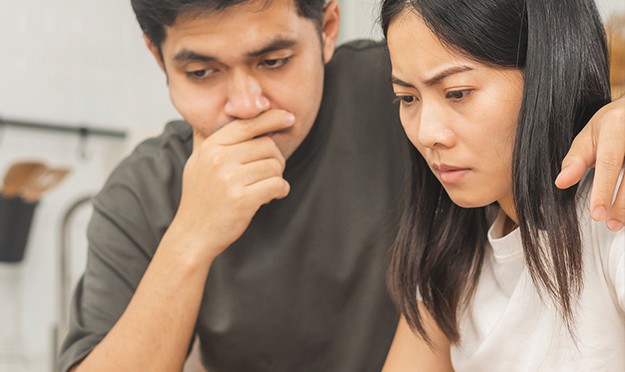 couple looking concerned