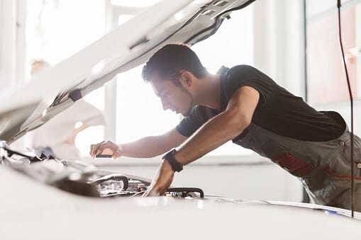 man under car hood