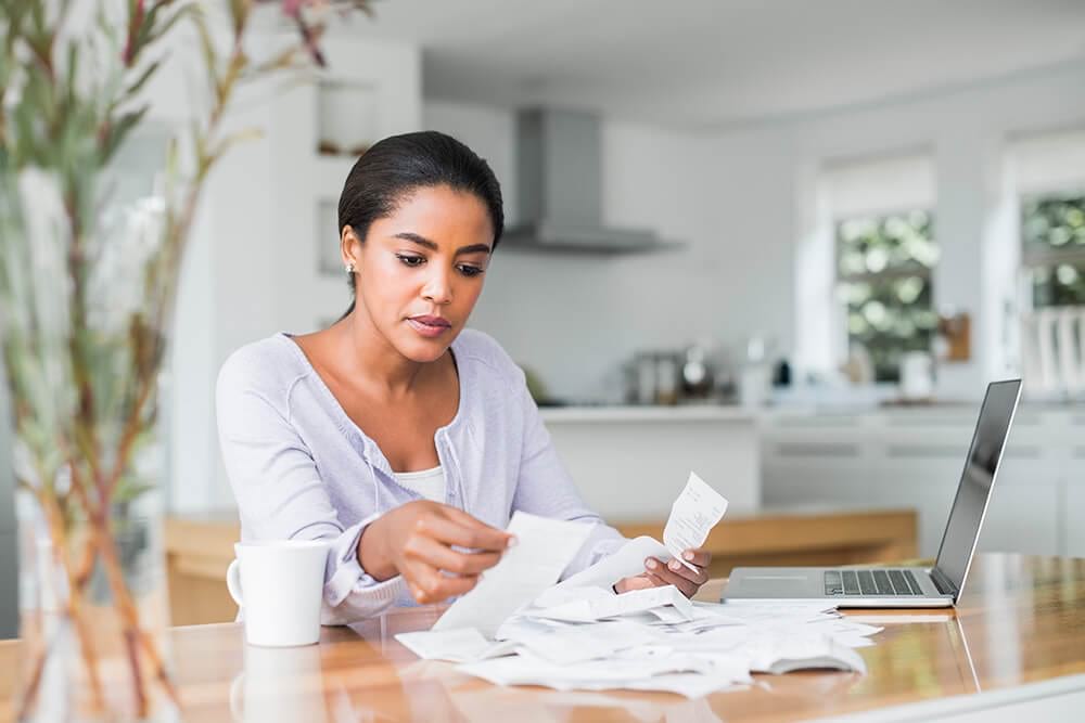 woman computer receipts